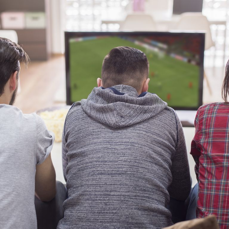friends watching football